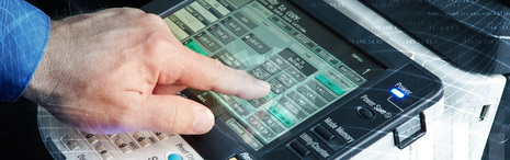 Employee using office printer. 