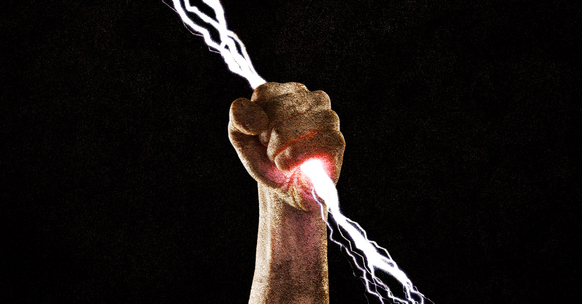 Hand holding lightning bolt