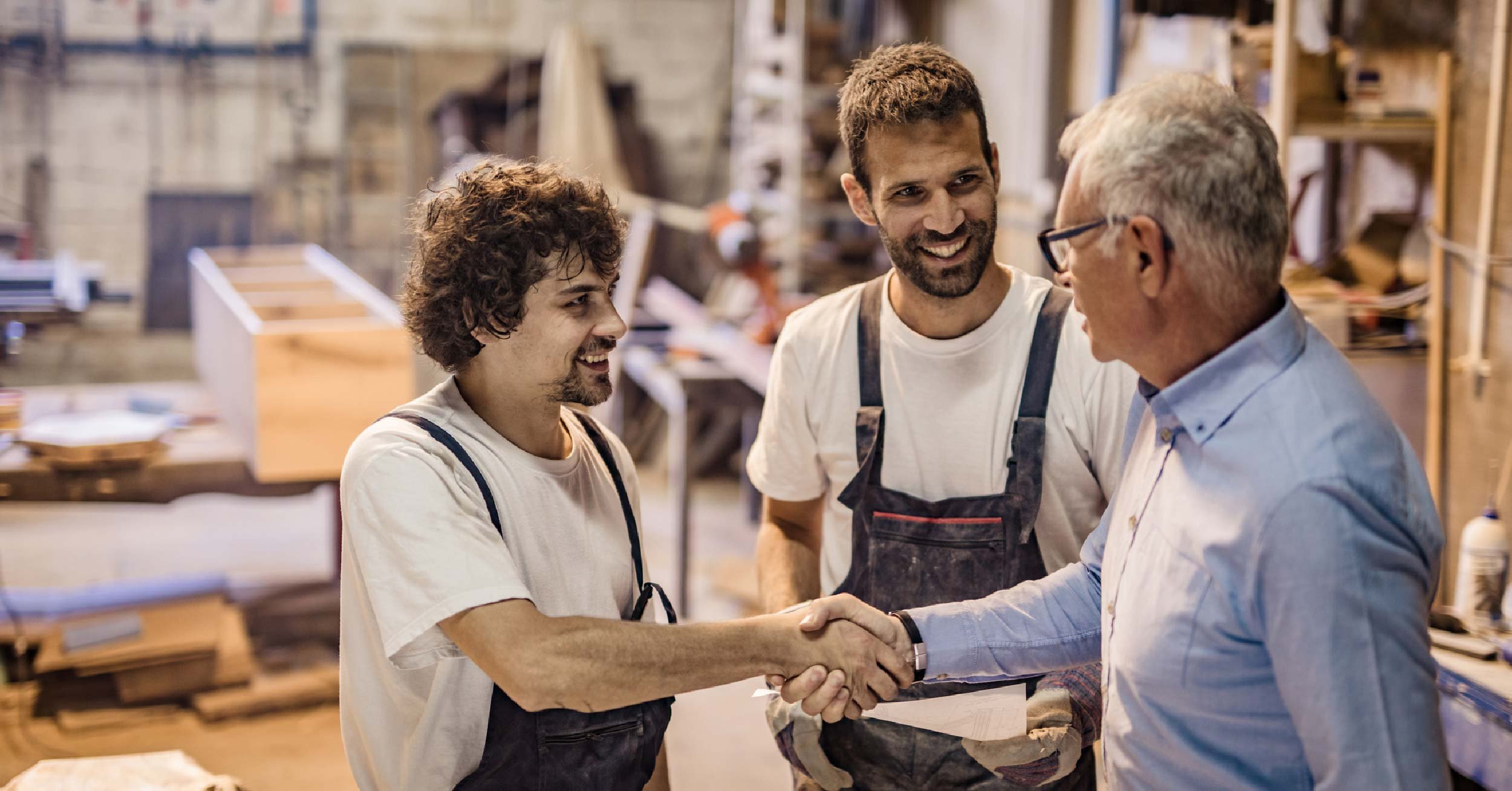 Small business owners shaking hands