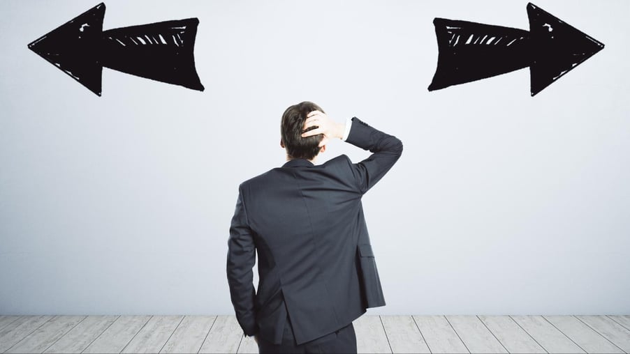 A business executive isn't sure which direction to take.