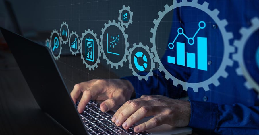 A man's hands rest on a keyboard under a depiction of the inner workings of managed print services.