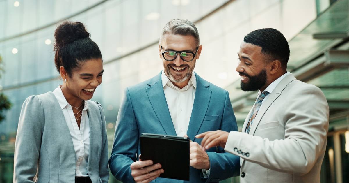 Three executives discussing next steps