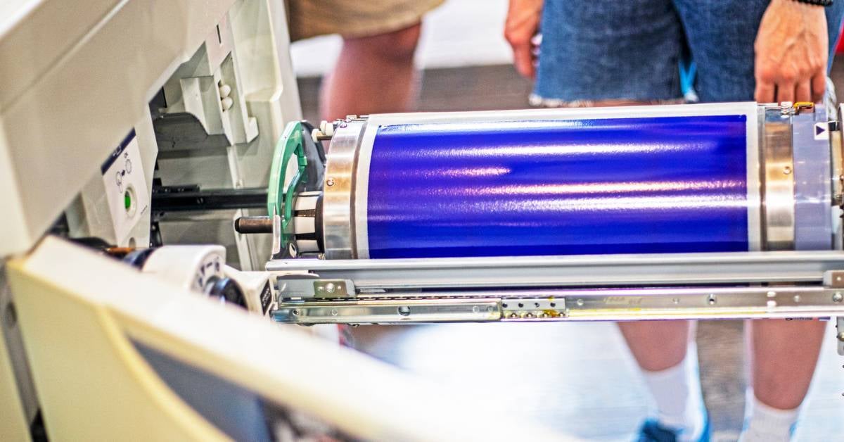 A-blue-copier-drum-being-changed-by-a-copier-technician