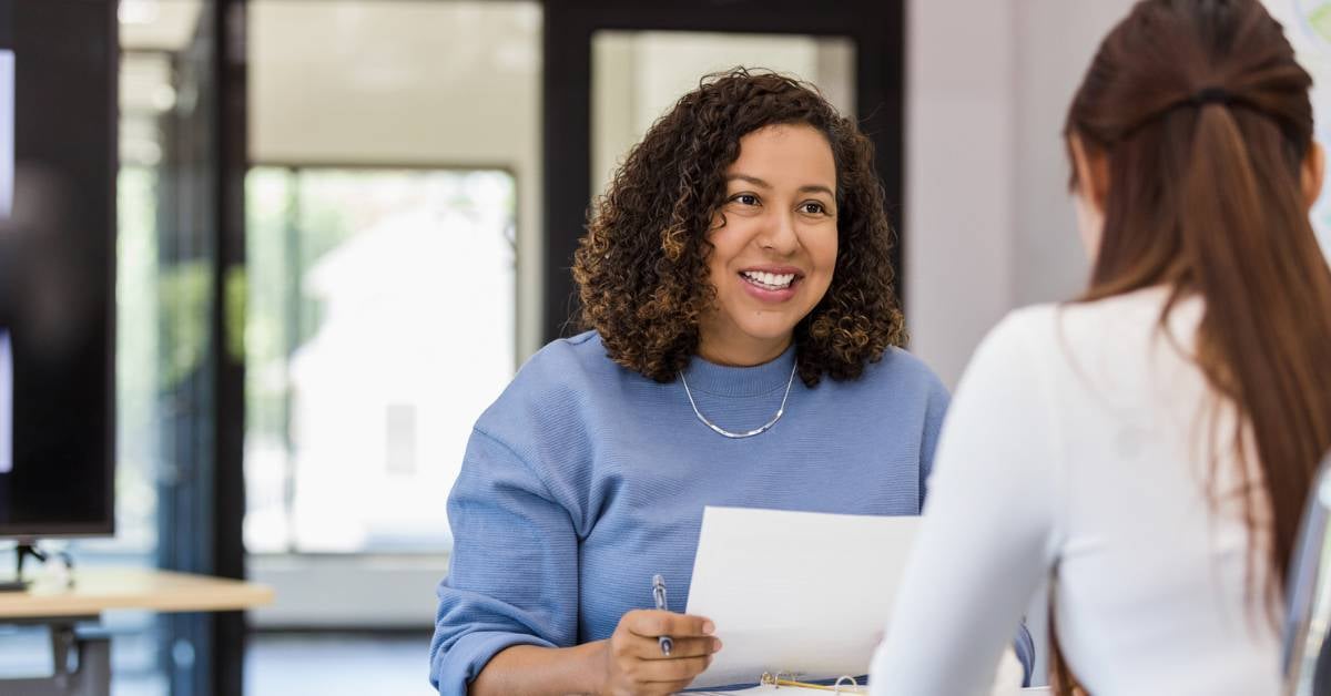 Two women discuss a potential business partnership.