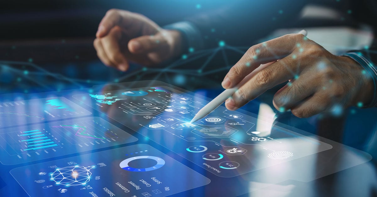 A worker uses a stylus on a business analysis screen.