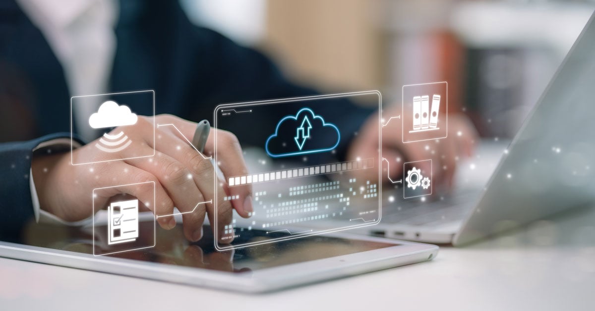 Businessman interacting with a digital cloud storage interface.