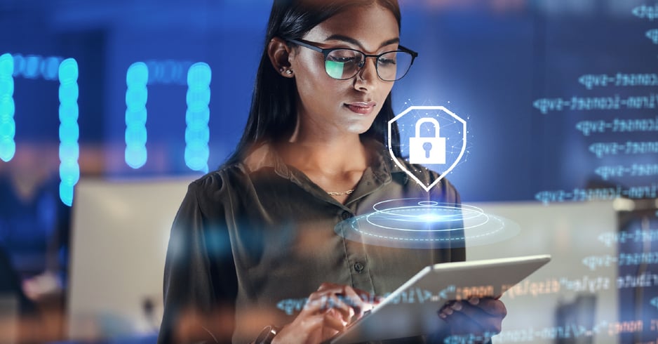 A female IT pro checks the security of her business's internect connection on a tablet.