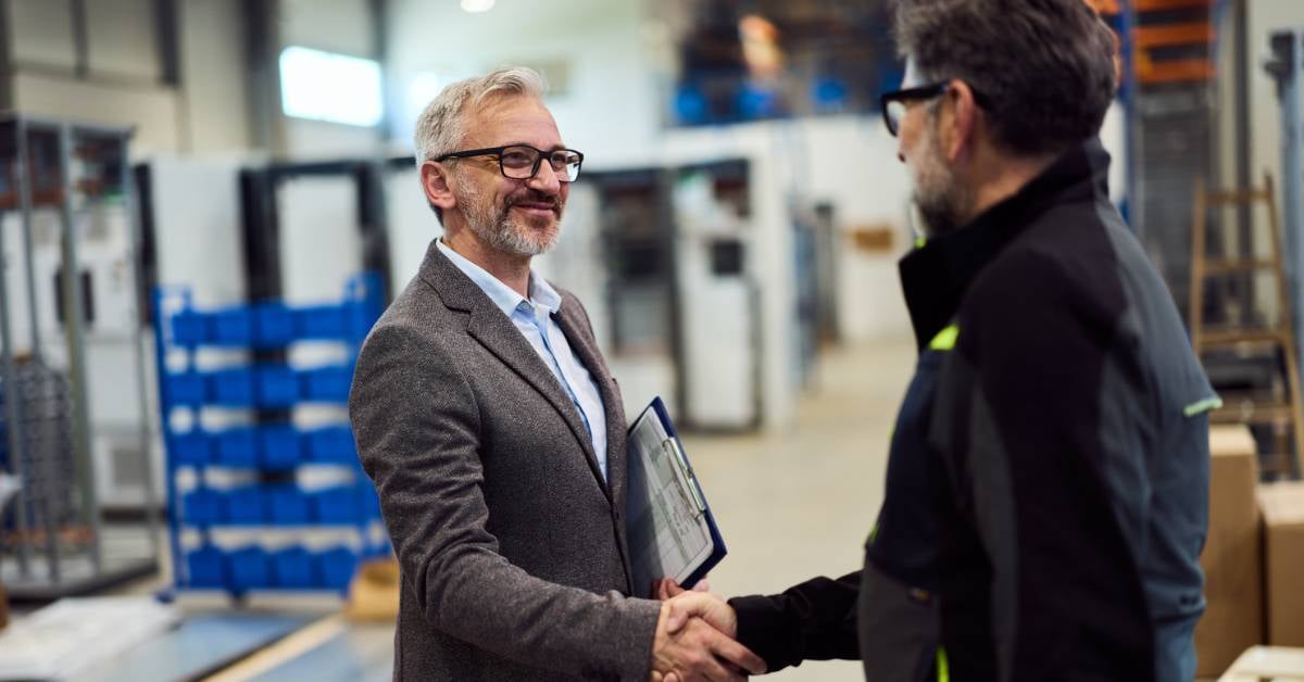 A manufacturing sector executive meets with a potential vendor.