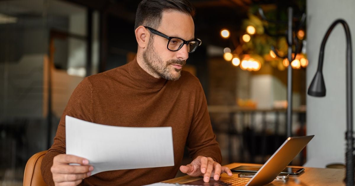 An employee researches print solutions online.