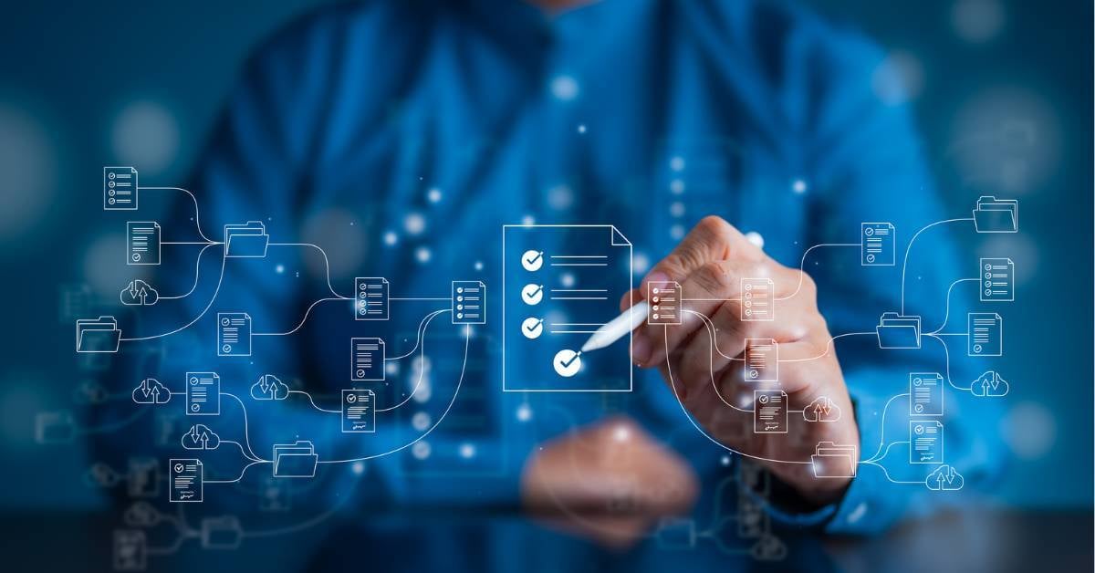 A closeup of a man's hands as they check specific workflows.