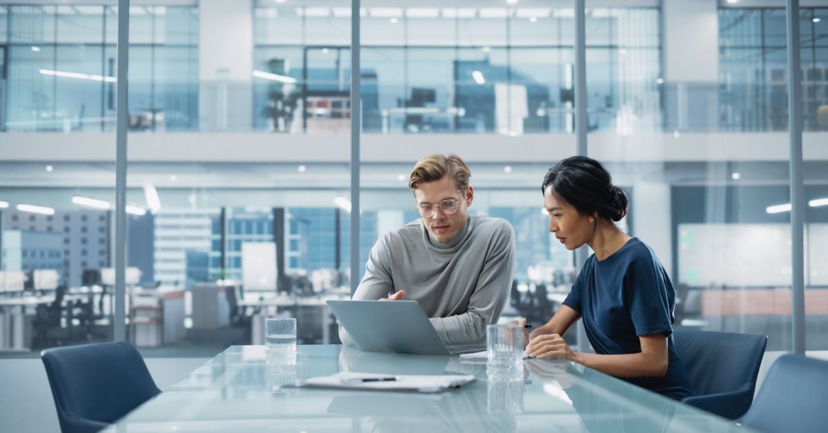 Business IT staff talking through a new business phone system plan.