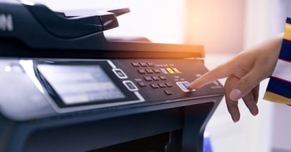 A-closeup-of-a-staff-member-adjusting-printer-settings