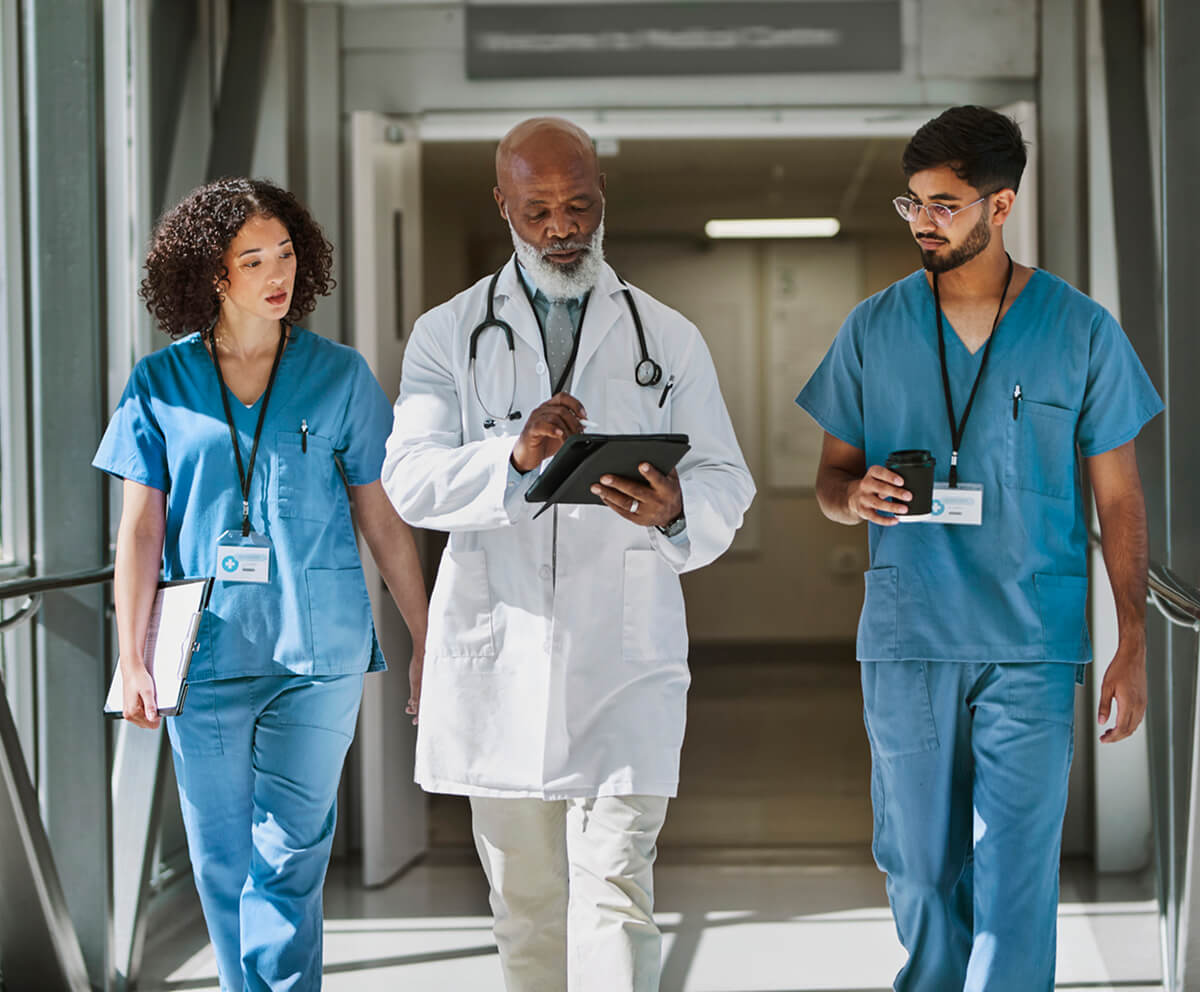 doctor-and-nurses-walking-with-tablet-shorter