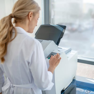 A doctor reviewing printer settings.