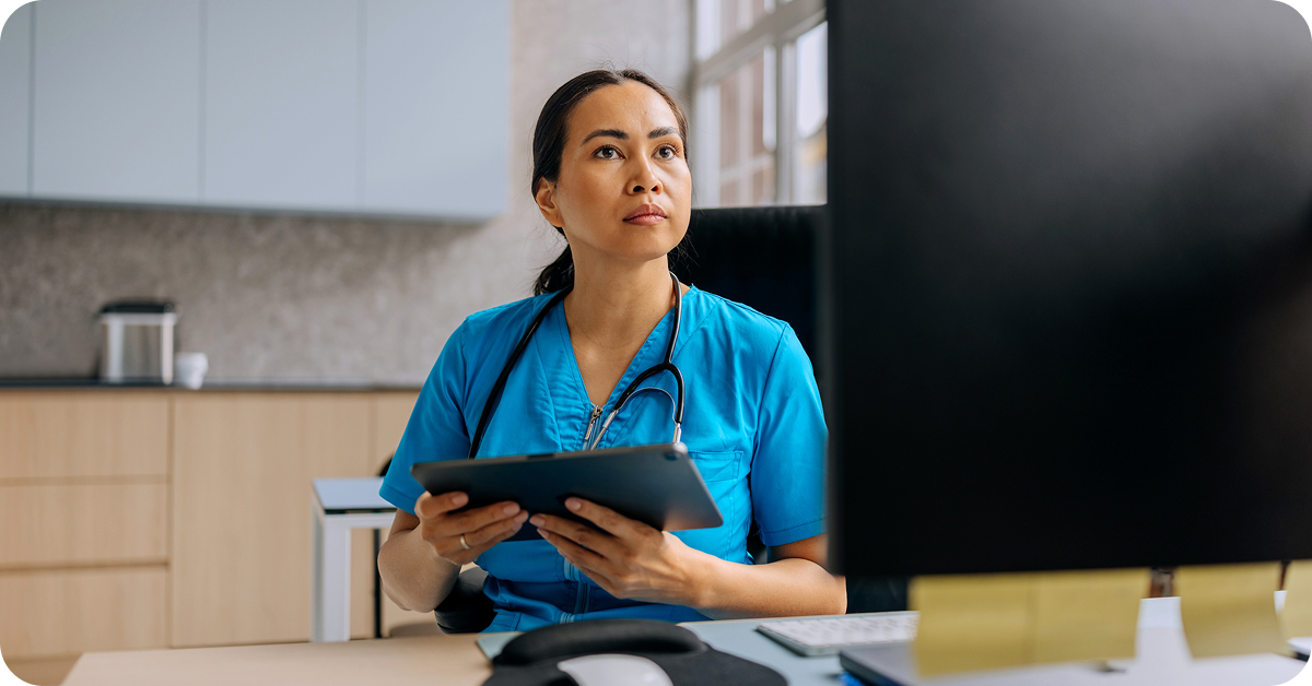 doctor-using-tech-with-concern