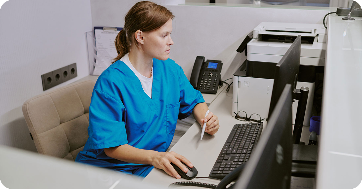 healthcare-working-next-to-office-printer