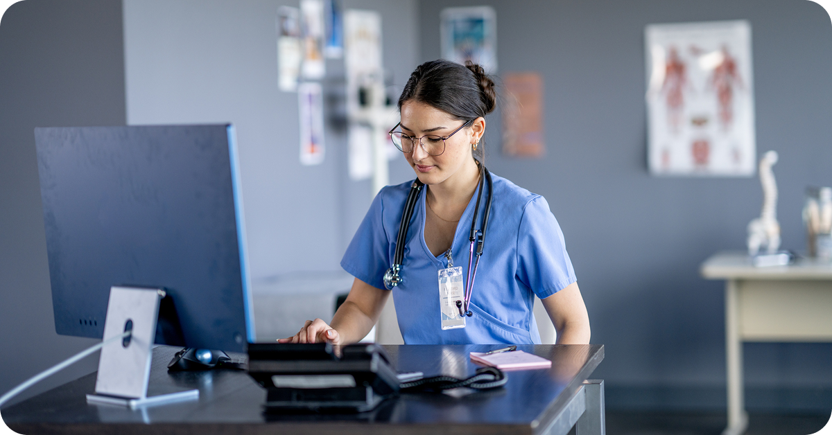 nurse-using-computer-in-exam-room