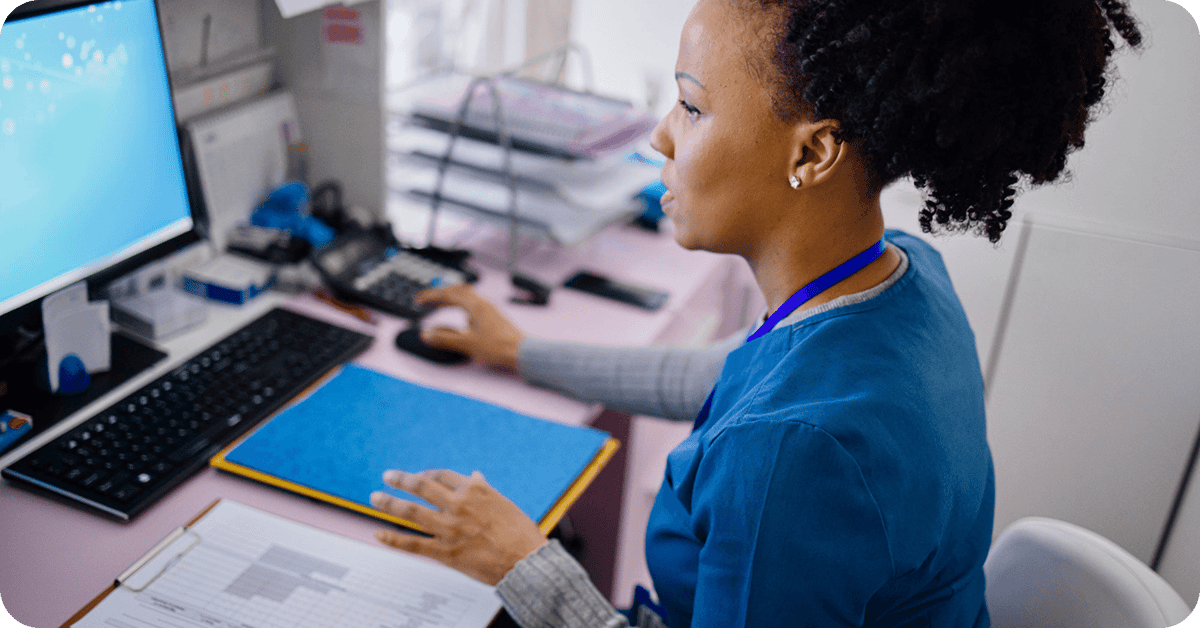 nurse-working-with-charts-and-files-min