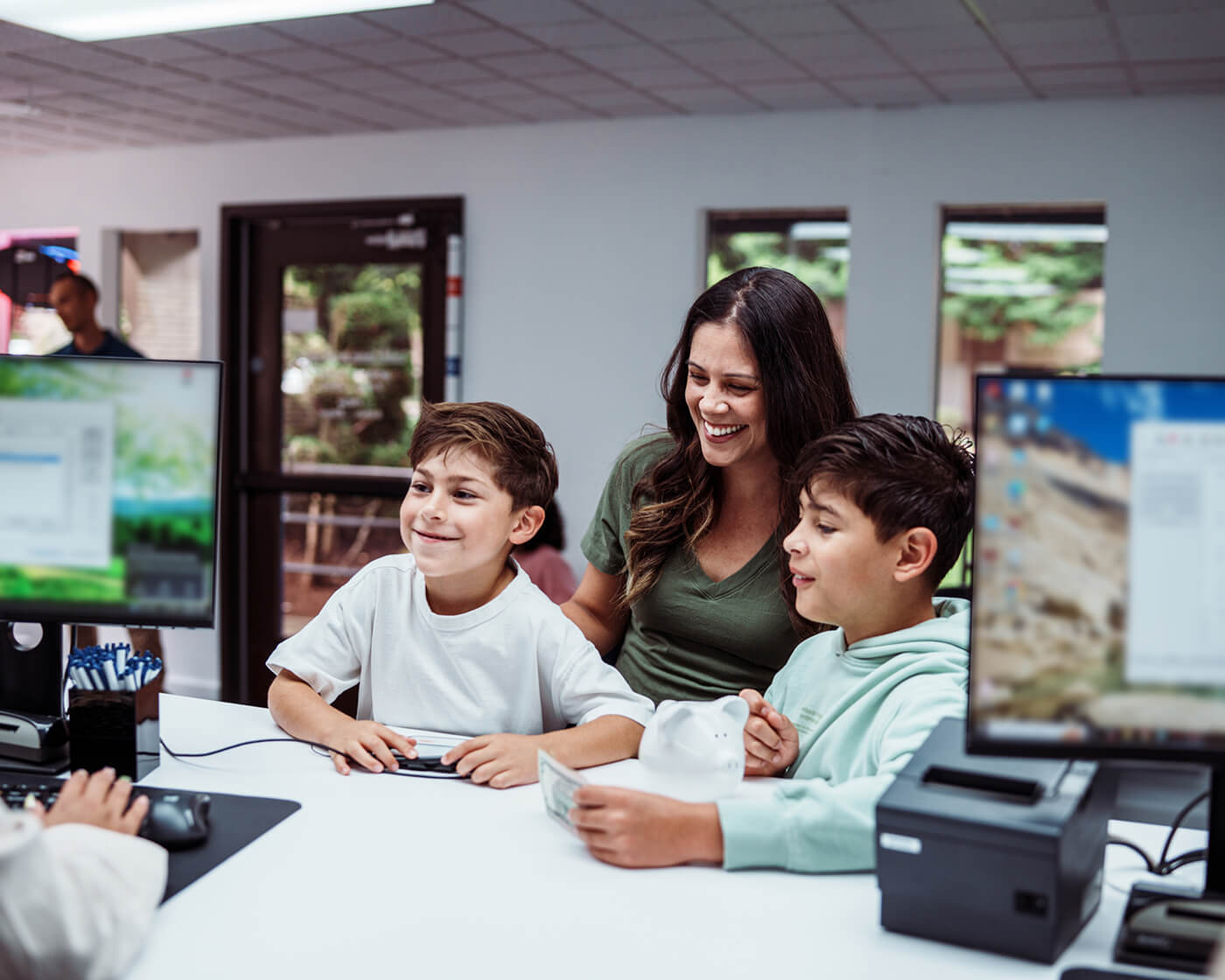 A family inside a bank lobby.