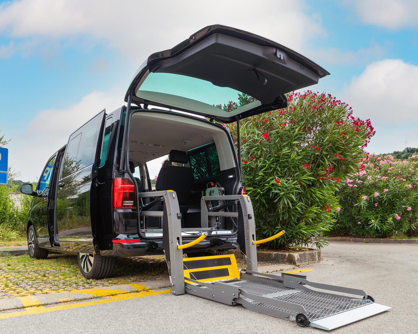 A handicapped assistance van with a lift-out.