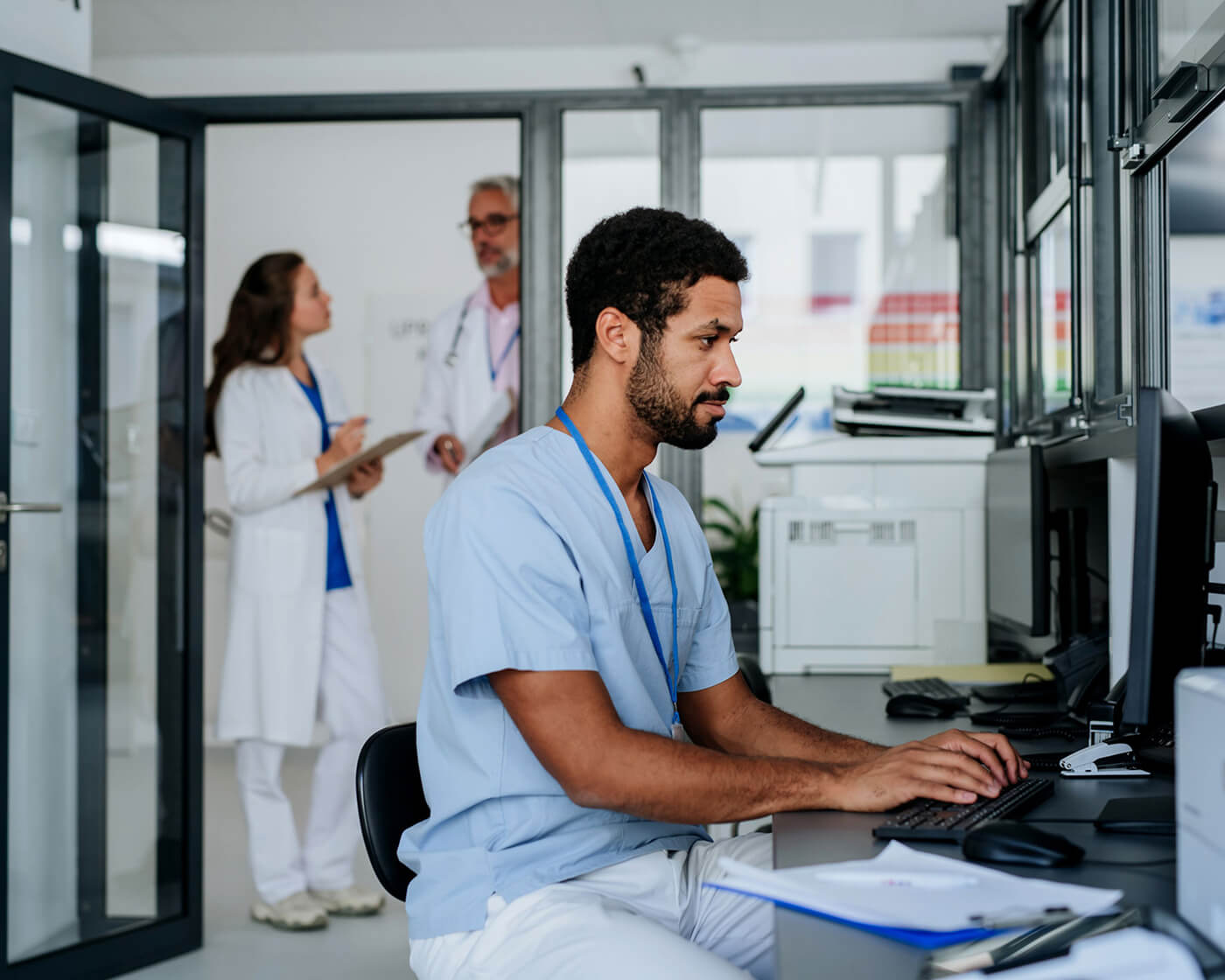 A nurse works on a computer at a regional health center.