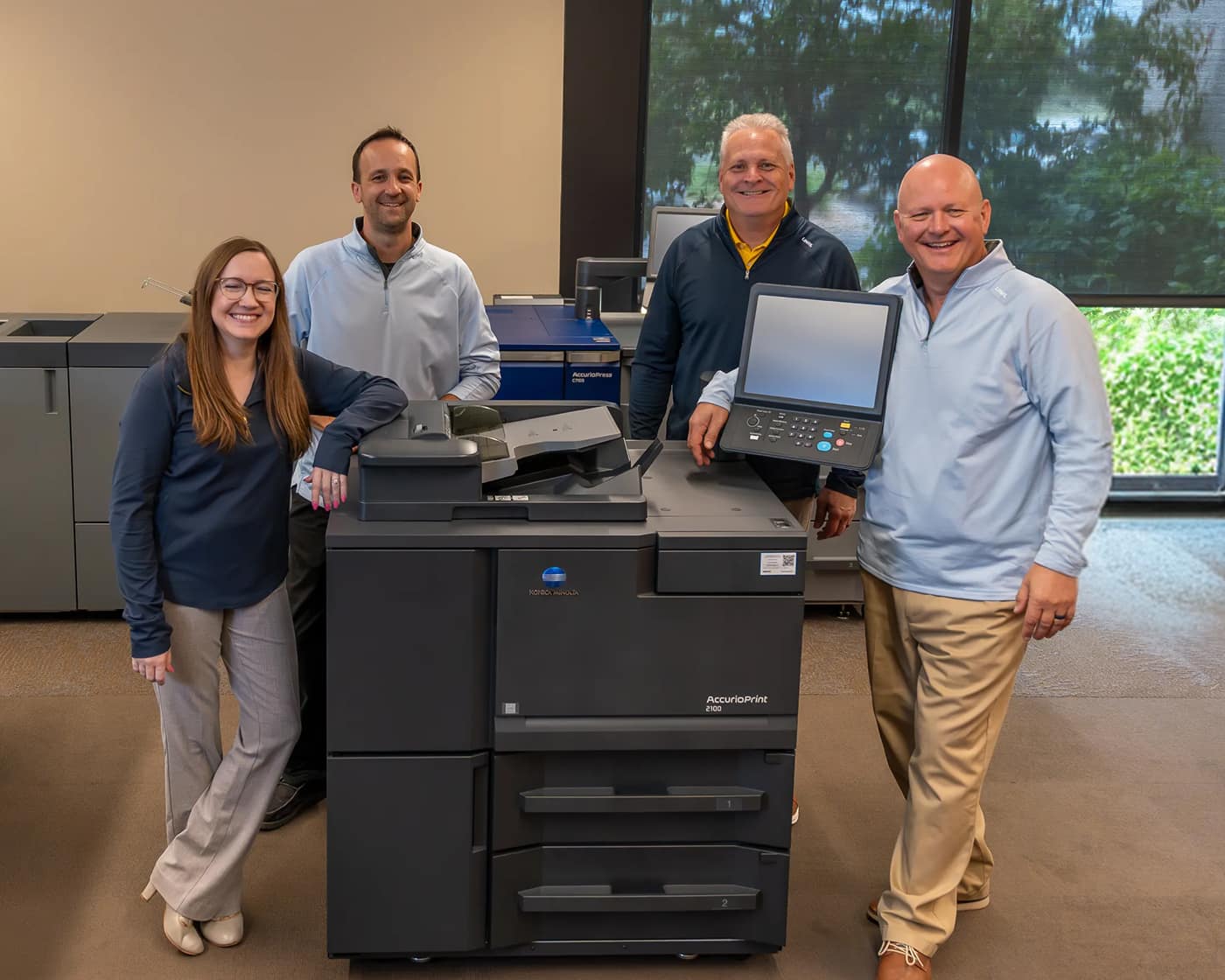 Marco employees in their print production showroom.