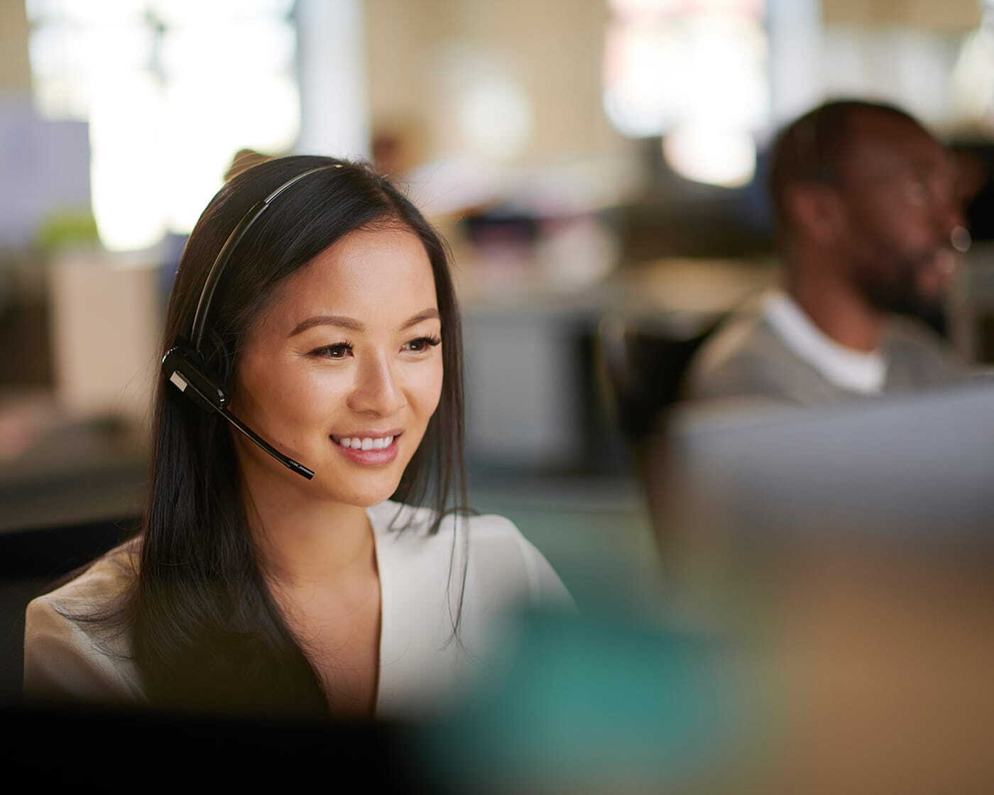 woman-talking-to-someone-on-headset-bank-setting