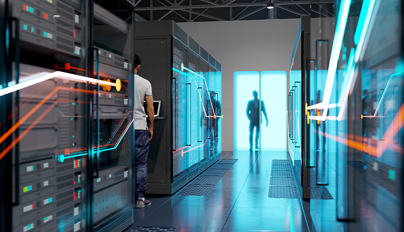 An engineer walking down a server hall. 