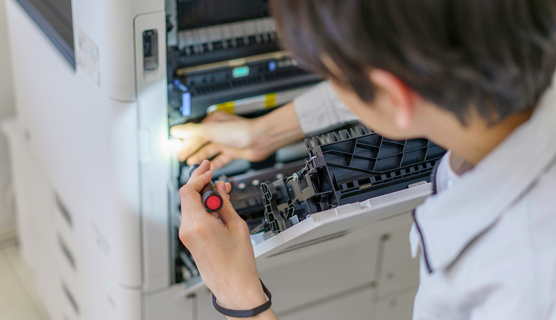 A man working on a copier.