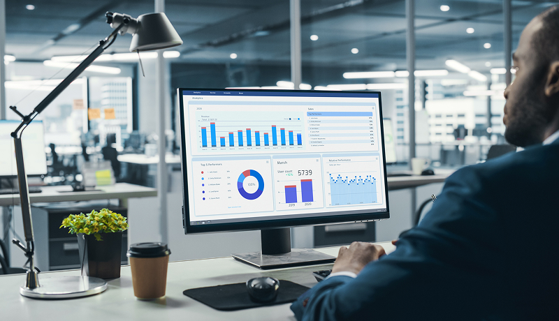 A person viewing analytics on a laptop. 