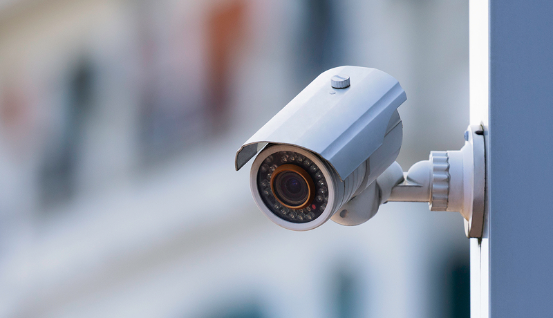 Security camera mounted on the exterior of a building.