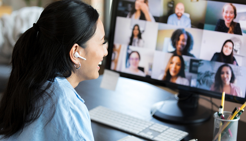 Woman participating in a video conference on her laptop.