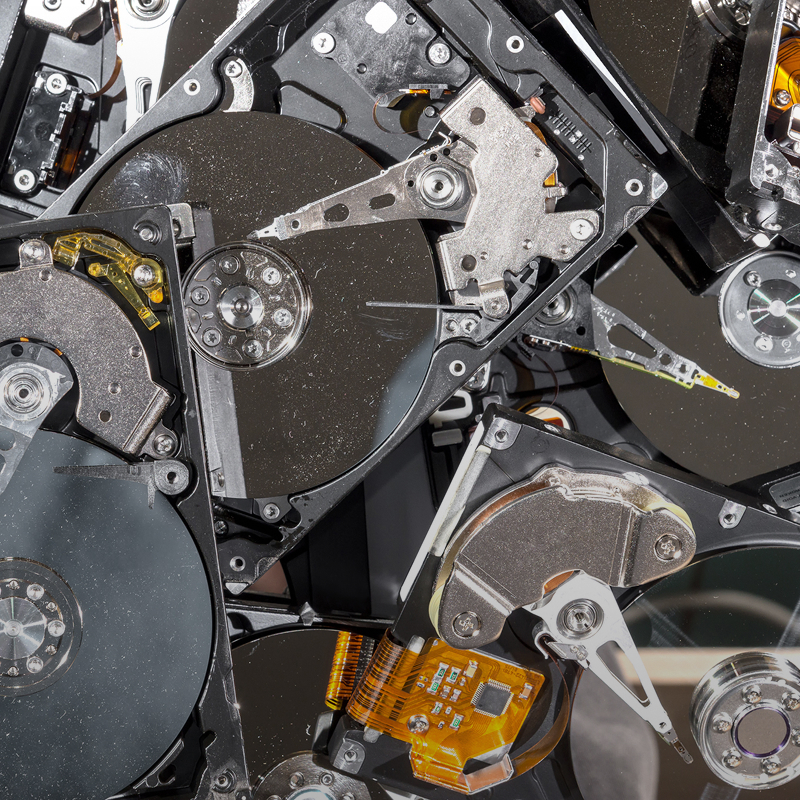 Destroyed hard drives ready for secure disposal.