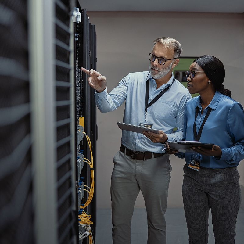 it-team-on-location-examining-servers-square