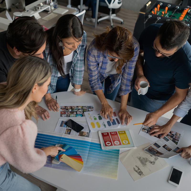 marketing-team-looking-at-prints