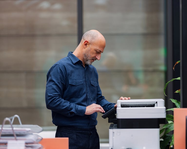industrial-worker-next-to-printer