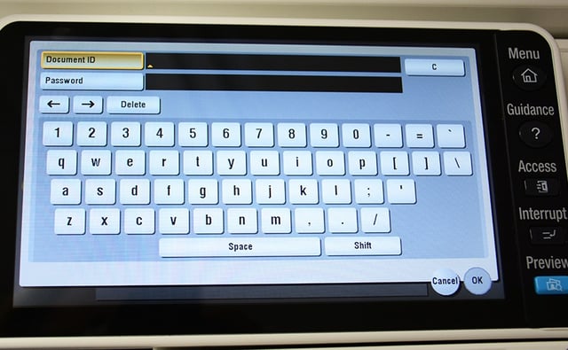Image of a multi-function printer screen depicting a keyboard and requesting a Document ID and password to enable secure printing.