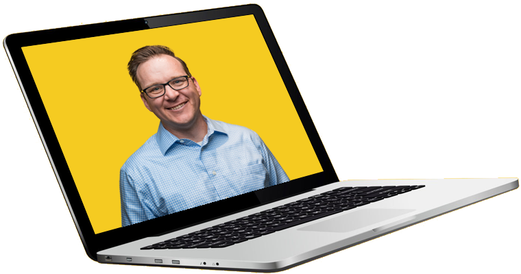 man smiling on laptop