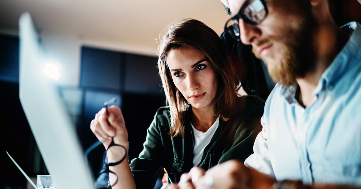 Team working together on cybersecurity.