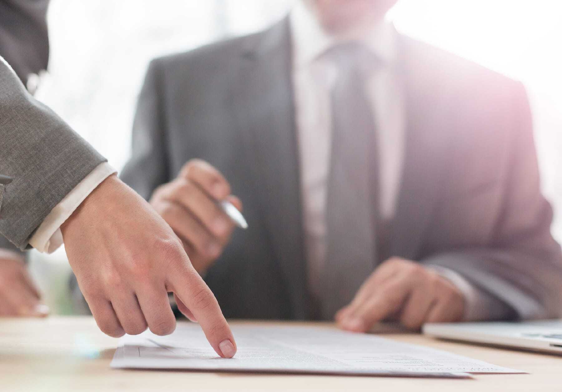 A business executive signing a contract.