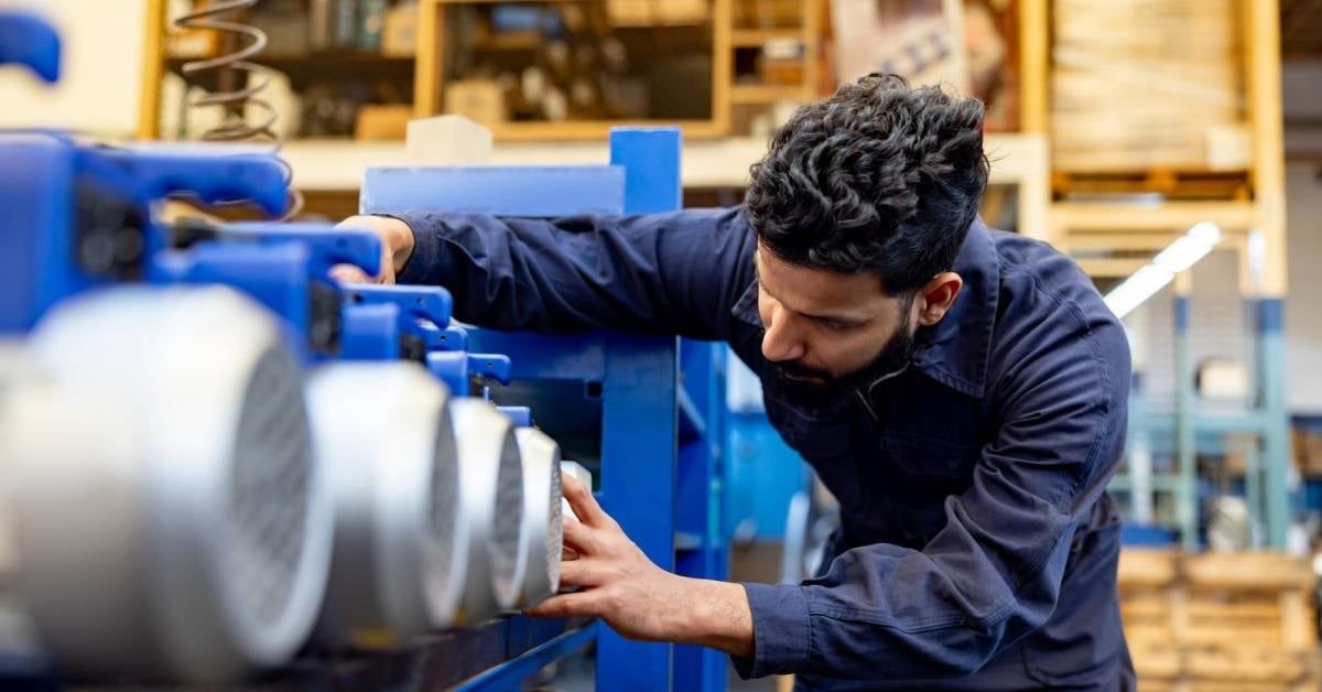 A-worker-at-a-pump-manufacturing-plant-examining-products