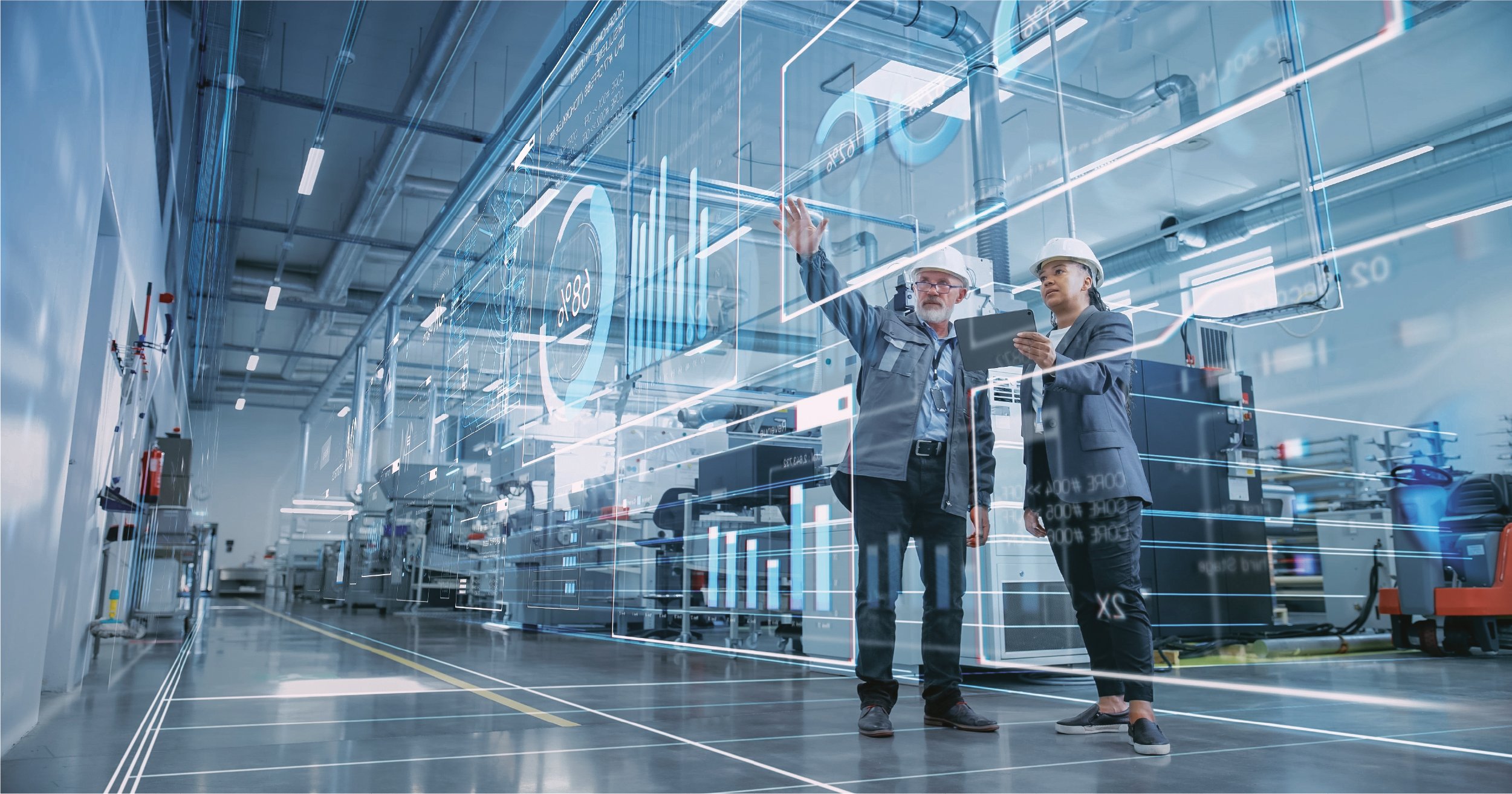 Factory with two engineers using digitalization to meet goals.