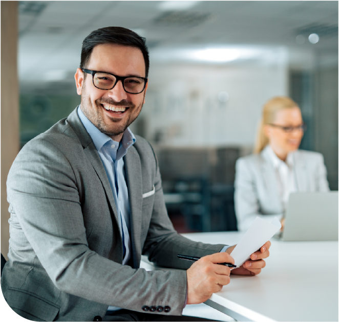 A business owner looks over key statistics indicating how much they've saved with Marco's managed print services.
