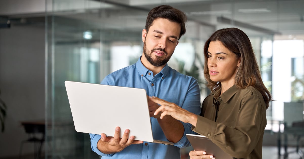 Tech person using computer.