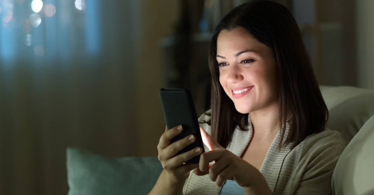 Happy patient scheduling appointment with modern healthcare technology. 